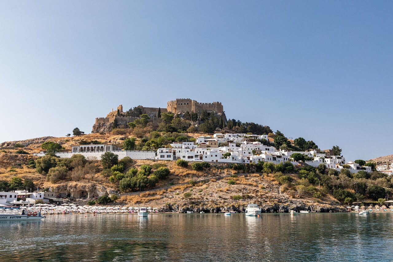 The Acropolis of Lindos above the white town and bay on Rhodes