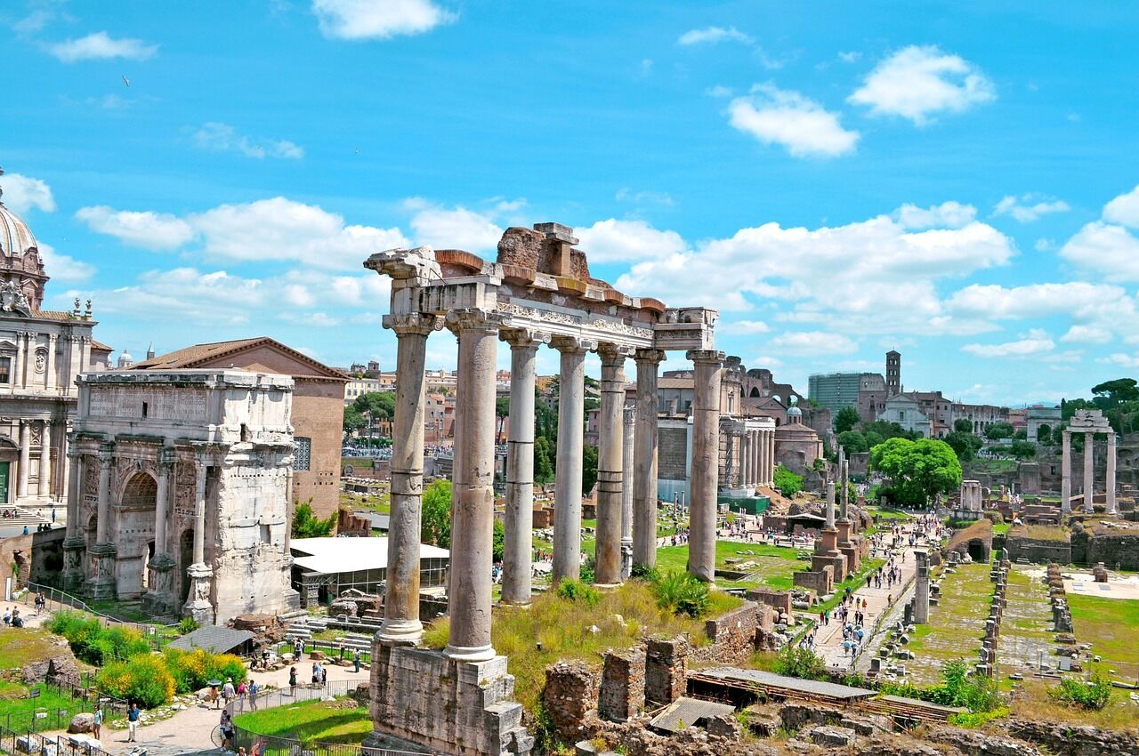 Columns of the Roman Forum in Rome under a blue sky